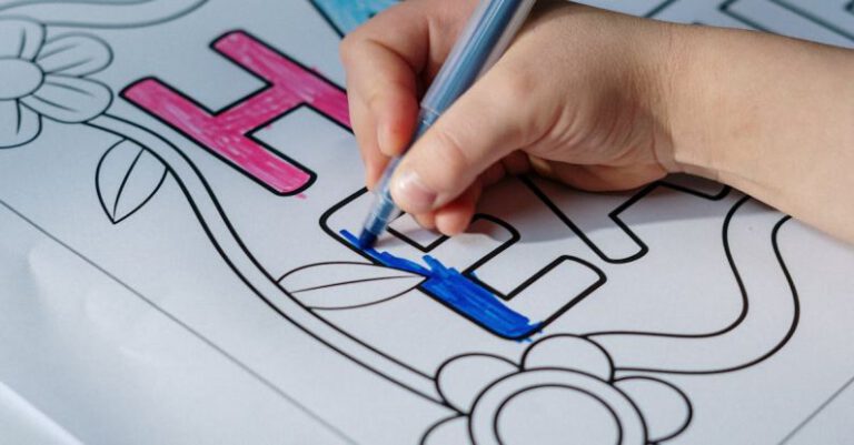 DIY Tips - Kid Coloring Happy Easter on White Paper