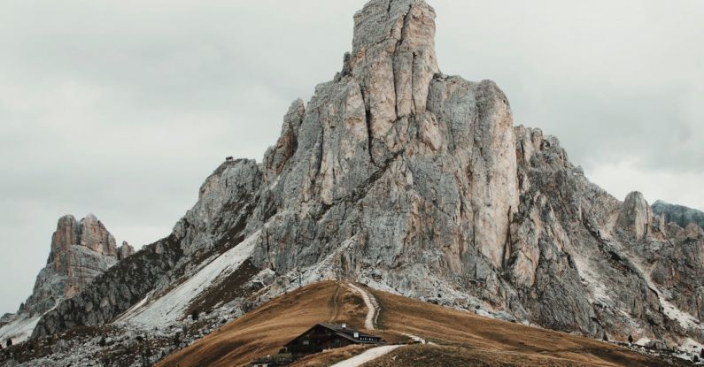 Mountain Passes - Wooden Cottage by the Road in the Italian Dolomites